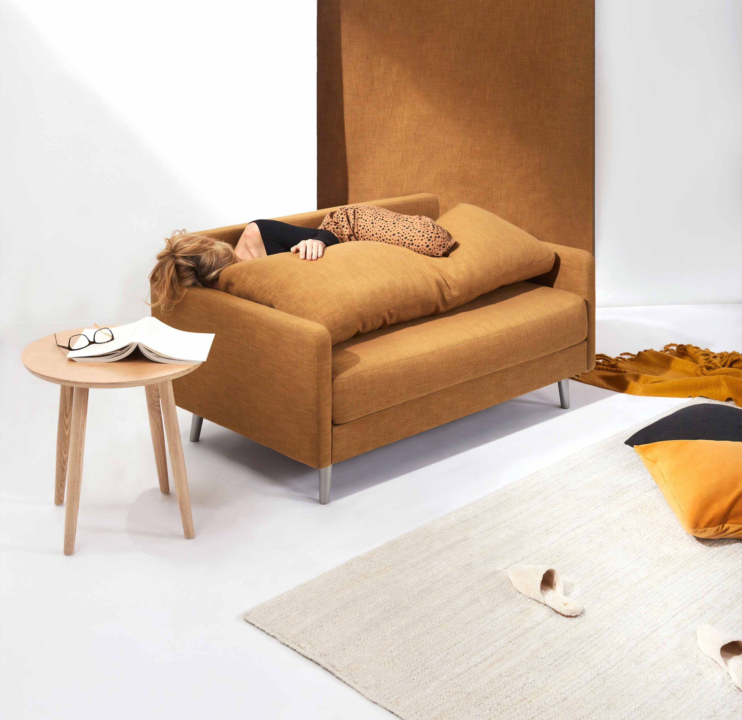 Woman Laying on Brown Sofa 1 Woman Laying on Brown Sofa 1